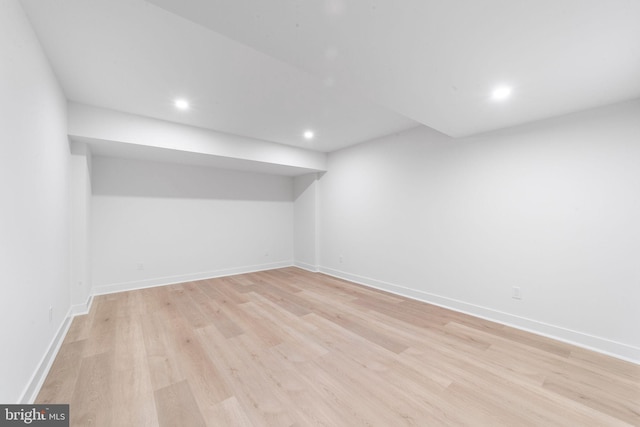 basement featuring light wood-type flooring