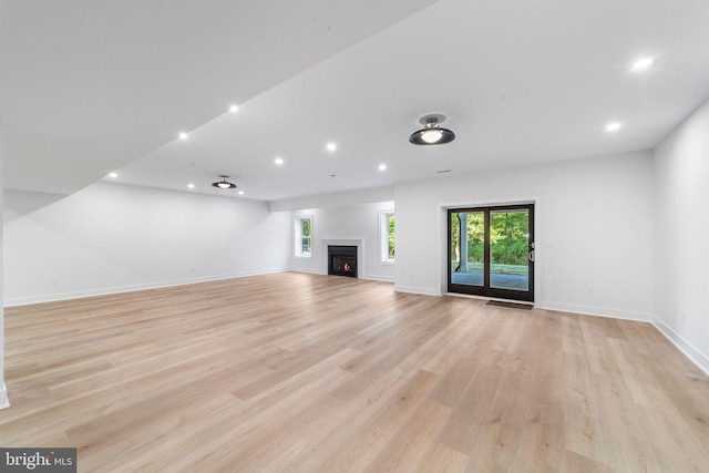 unfurnished living room featuring light hardwood / wood-style flooring