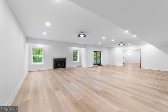 unfurnished living room with light hardwood / wood-style floors