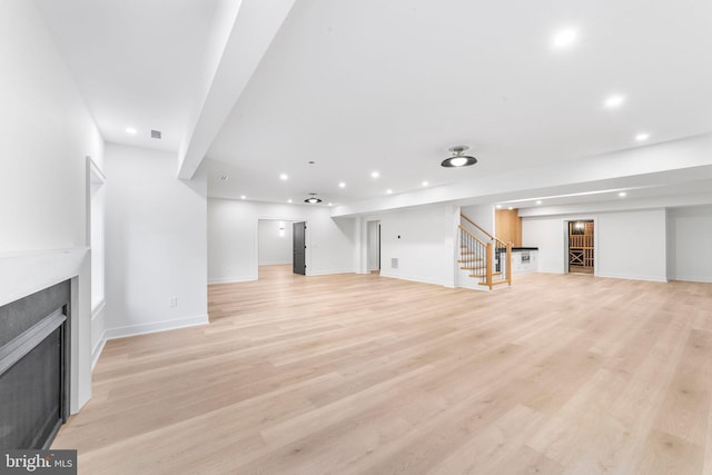 unfurnished living room featuring light hardwood / wood-style flooring