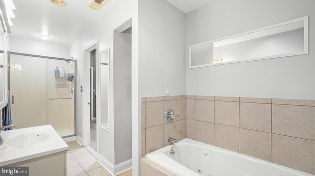 bathroom with tile patterned flooring, vanity, and shower with separate bathtub