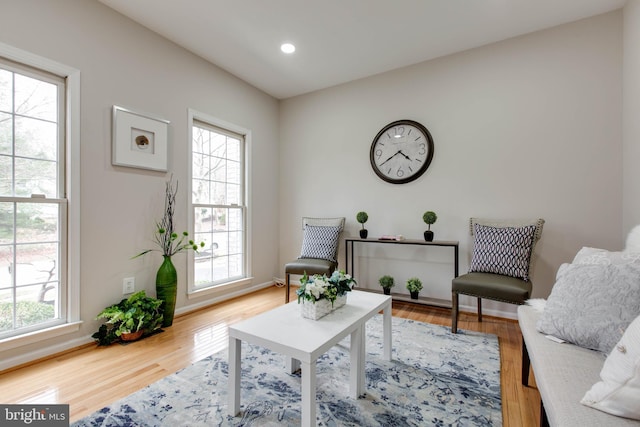 sitting room with recessed lighting, baseboards, and wood finished floors