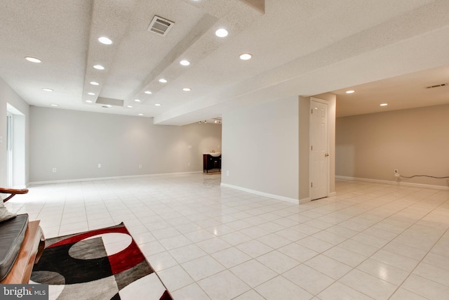 interior space with recessed lighting, light tile patterned floors, baseboards, and visible vents