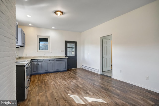 kitchen featuring recessed lighting, dark wood-style flooring, light countertops, electric stove, and baseboard heating