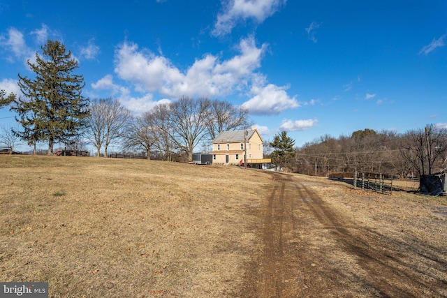 view of yard with a rural view