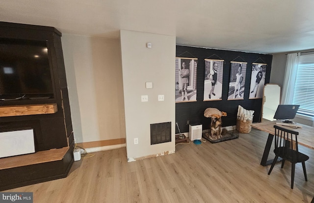 living room with light hardwood / wood-style floors