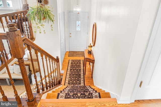 stairs with wood-type flooring