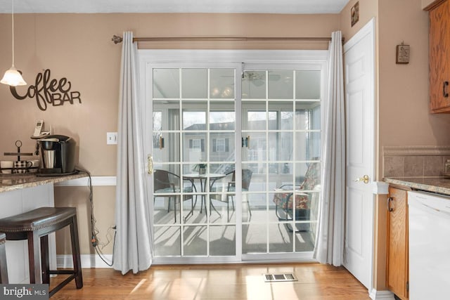 doorway to outside featuring light hardwood / wood-style flooring