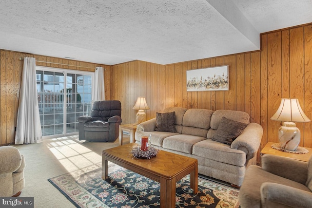 living room with light carpet, wooden walls, and a textured ceiling