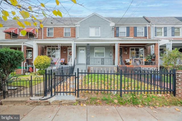 multi unit property featuring a porch