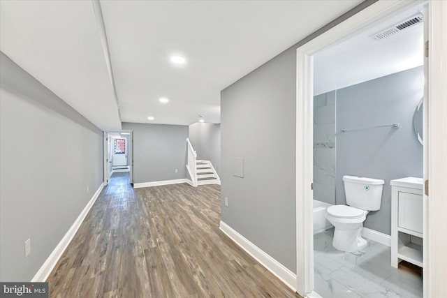 corridor featuring dark hardwood / wood-style floors