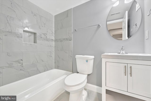 full bathroom featuring vanity, toilet, and tiled shower / bath combo