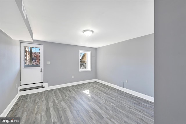 empty room with hardwood / wood-style flooring