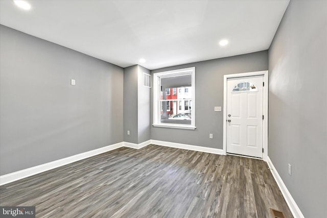 entrance foyer with dark hardwood / wood-style floors