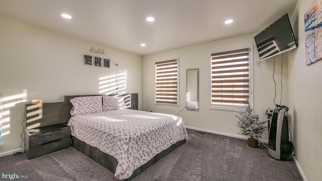 bedroom featuring dark colored carpet