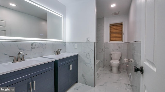 bathroom featuring vanity, toilet, and walk in shower