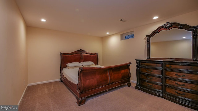 bedroom featuring light carpet