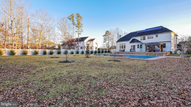 view of yard with a gazebo and a covered pool