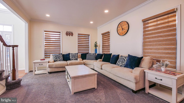 carpeted living room with ornamental molding