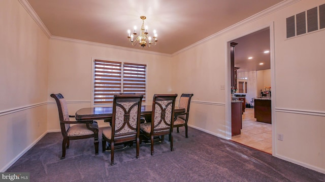 carpeted dining area featuring ornamental molding and an inviting chandelier