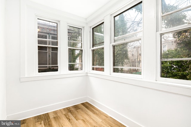 unfurnished sunroom featuring a wealth of natural light