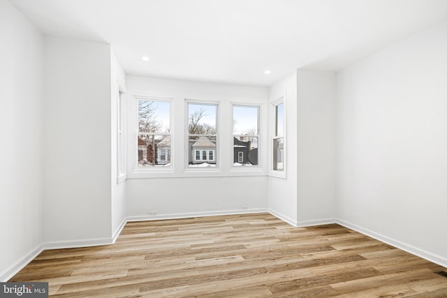 empty room with light hardwood / wood-style floors