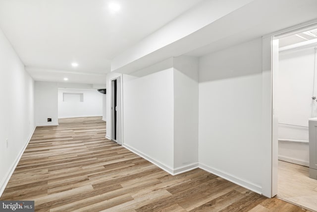 hallway with light wood-type flooring