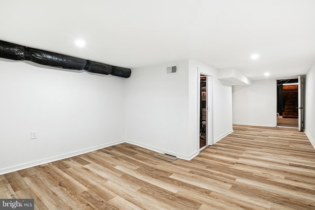 basement featuring light hardwood / wood-style floors