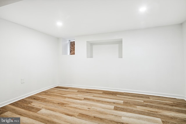 unfurnished room with wood-type flooring