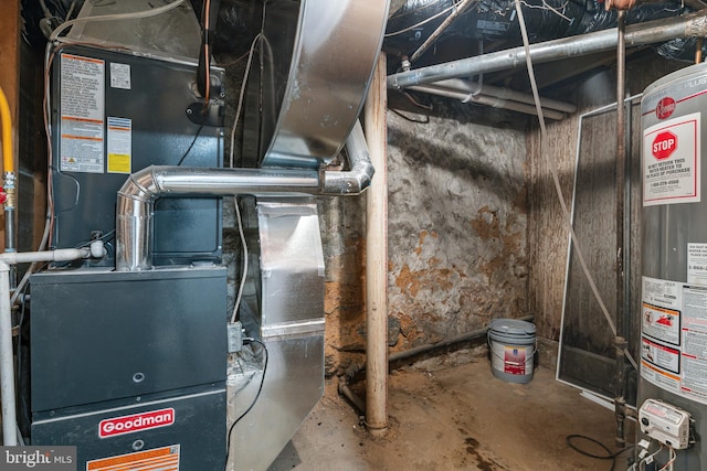 utility room with heating unit and gas water heater