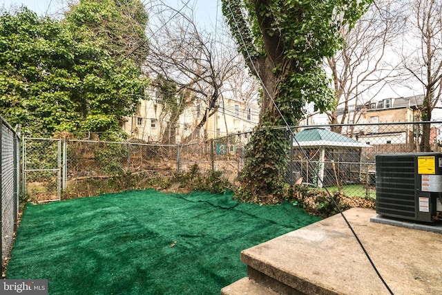 view of yard featuring central air condition unit