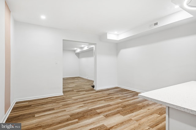 basement featuring light hardwood / wood-style flooring