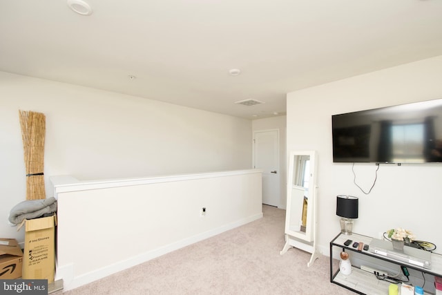 living room featuring light carpet