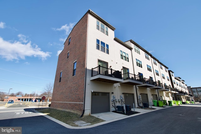 view of property featuring central AC unit