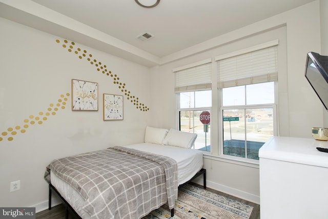 bedroom with hardwood / wood-style floors