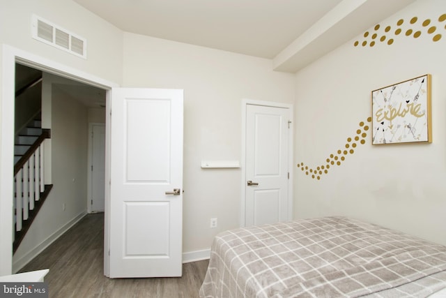 bedroom featuring hardwood / wood-style flooring