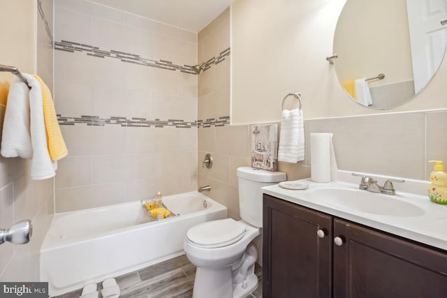 full bathroom with shower / bathing tub combination, vanity, toilet, and wood finished floors