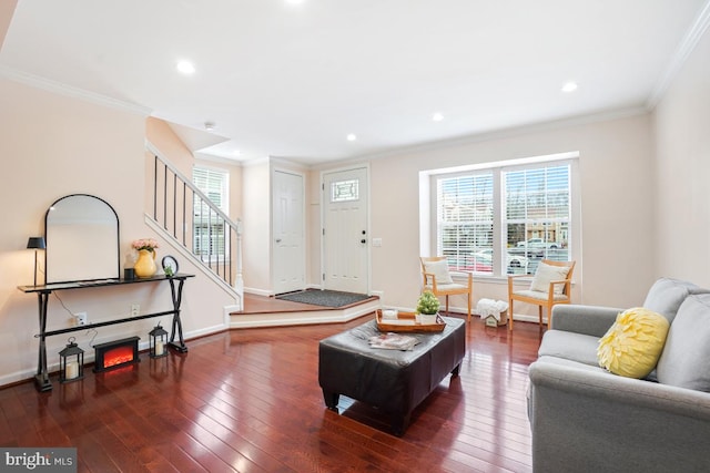 living room featuring dark wood-style floors, stairway, baseboards, and crown molding