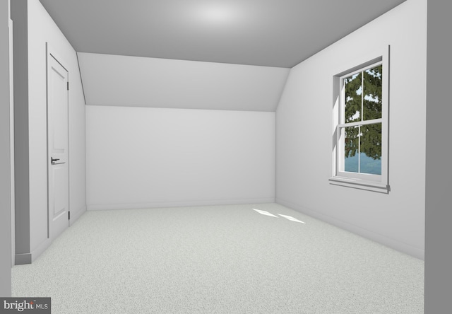 additional living space featuring light carpet and lofted ceiling