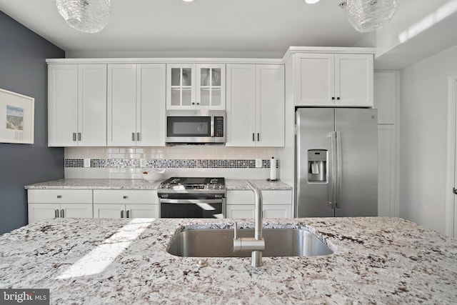 kitchen featuring white cabinetry and stainless steel appliances