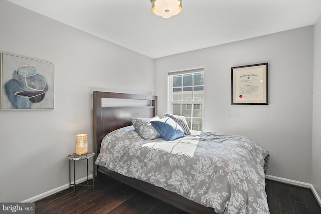 bedroom featuring dark hardwood / wood-style flooring