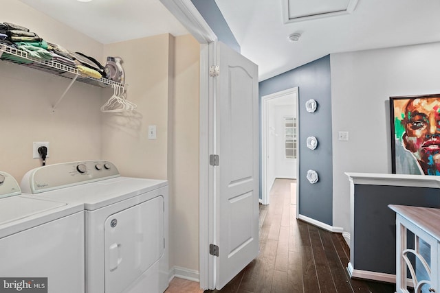 clothes washing area featuring separate washer and dryer and dark wood-type flooring