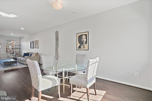 dining space featuring dark hardwood / wood-style flooring