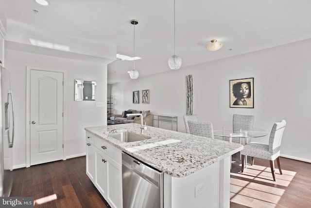 kitchen with sink, white cabinetry, hanging light fixtures, a kitchen island with sink, and stainless steel dishwasher