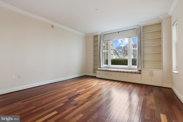 spare room with hardwood / wood-style flooring and ornamental molding