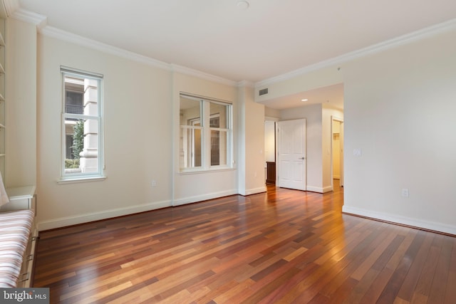 unfurnished living room with crown molding and dark hardwood / wood-style floors