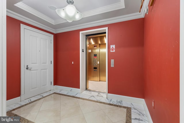 entrance foyer featuring crown molding, elevator, and a raised ceiling