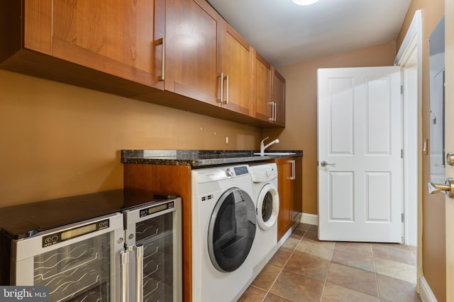 clothes washing area with beverage cooler, separate washer and dryer, sink, and light tile patterned floors