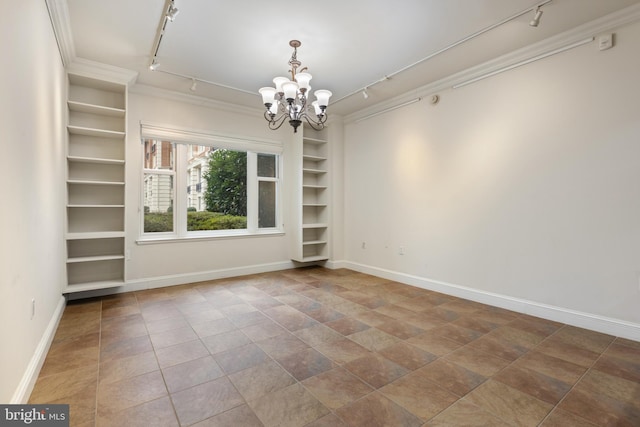 unfurnished dining area featuring rail lighting, a chandelier, and built in features