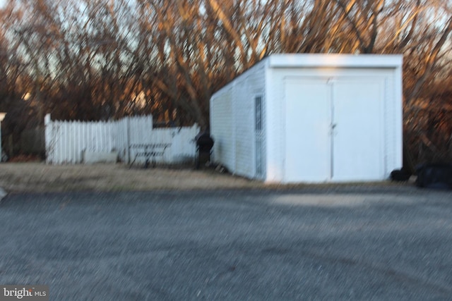 view of shed with fence